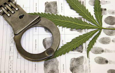 marijuana leaf and handcuff
