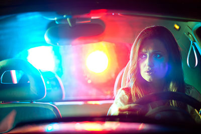 woman being pulled over by police