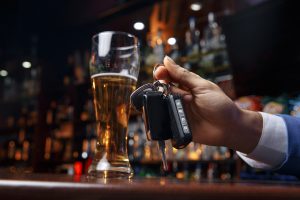 Man Drinking at Bar with Car Keys Man Drinking at Bar with Car Keys