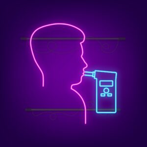 A man taking a breathalyzer test in neon lights 