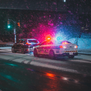 A person being pulled over for a DUI in winter time